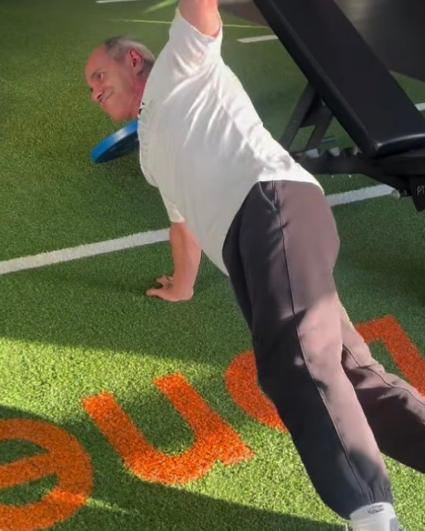 Francisco in a side plank on the turf at Club16 Richmond
